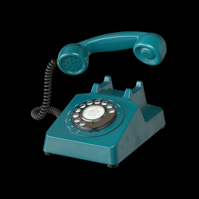 Blue old rotary telephone with the receiver raised
